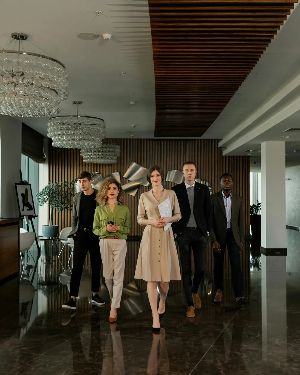 Professionals walking through the marble lobby of a luxury hotel