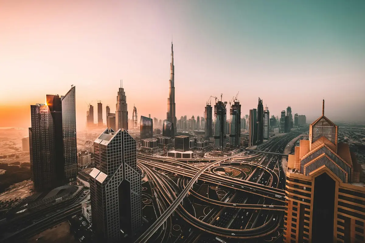Dubai skyline and waterfront at dusk, representing premier UAE real estate