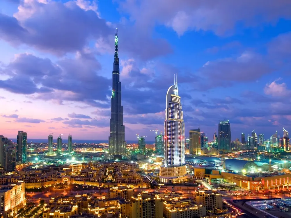 Downtown Dubai and the Burj Khalifa lit up at dusk